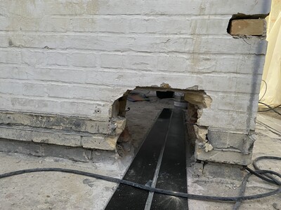Penetration in the façade wall to the anchorage zone inside the building.
