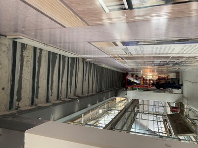 S&P C-Laminate installed over temporary dust and noise wall.