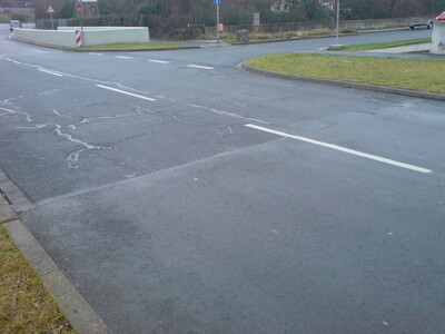 Road section without damage to the surface