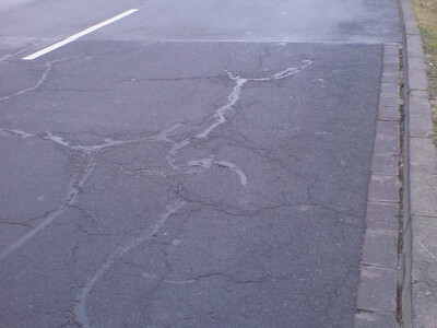 Road section without damage to the surface